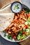 Kebab served with pita bread, vegetable salad and tzatziki