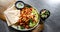 Kebab served with pita bread, vegetable salad and tzatziki