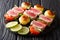 Kebab skewers of fresh tuna, tomatoes, potatoes and green onions