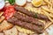 Kebab, traditional turkish, greek meat food on pita bread, top view