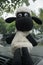 KEBUMEN, INDONESIA â€“ AUGUST 2, 2021: A shaun the sheep doll who is sitting and relaxing