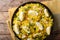 Kedgeree curry rice with smoked fish, eggs, cilantro close-up on