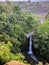 Kedung kayang waterfall and Merapi mountain view. Sunrise with forest scenery. Magelang, Indonesia