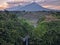Kedung kayang waterfall and Merapi mountain view. Sunrise with forest scenery. Magelang, Indonesia