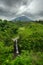 Kedung Kayang Waterfall and Mountain Merapi volcano. Java