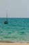 Keel boat moored at shore side, view from forest beach. Seascape