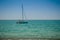 Keel boat moored at shore side, view from forest beach. Seascape