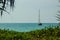 Keel boat moored at shore side, view from forest beach. Seascape