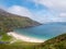 Keem bay and beach and Cliffs, Achill island, County Mayo, Ireland. Popular travel area with stunning nature scenery. Warm sunny