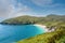 Keem beach, Achill island in county Mayo, Ireland, warm sunny day. Clear blue sky and water of the Atlantic ocean