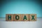 Keep away from hoax news, HOAX text wood block