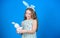 Keep calm and happy Easter. Little girl and rabbit toy. Small girl in rabbit ears with Easter toy. Little child in