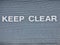 Keep clear sign on garage metal shutter door