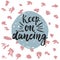 Keep on dancing - hand drawn lettering phrase isolated on the polka dot grunge background. Fun brush ink inscription for