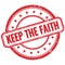 KEEP THE FAITH text on red grungy round rubber stamp