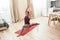 Keep going. Full-length shot of young curvy woman in sportswear standing in yoga pose on a mat at home