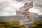 keep life simple text engraved on old wooden signpost outdoors in nature