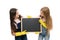 Keep it neat. School children in rubber gloves holding empty blackboard. Small pupils doing their duties during school