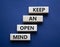Keep an open mind symbol. Wooden blocks with words Keep an open mind. Beautiful grey green background. Business and Keep an open