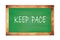 KEEP  PACE text written on green school board