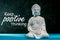 Keep Positive thinking - motivating message concept with Little Buddha statue. Think positive, be happy