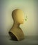 Keep quiet no words concept, realistic vintage mannequin with plant pierce from the inside,