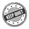 KEEP QUIET text written on black grungy round stamp