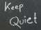 Keep Quiet written in a black board