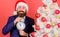 Keep track of time. Time to celebrate. Man bearded wear suit and santa hat hold clock. Businessman join christmas