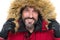 Keep your head snug in cosy hood. Happy man wear parka hood. Mature man smile in faux fur hood. Fashion trends for