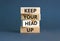 Keep your head up symbol. Concept words Keep your head up on wooden cubes. Beautiful grey table grey background. Business