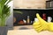 Keep your home virus-free. Woman showing thumb up in kitchen