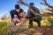 Keeper and a tourist petting a cheetah