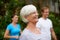 Keeping healthy and fit. a senior woman laughing outdoors with fellow fitness class members.