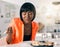 Keeping healthy with a plate of fish. a young woman enjoying a plate of sushi.