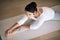 Keeping her wellness in check with yoga. a young woman stretching during her yoga routine.