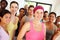 Keeping in shape keeps them happy. Portrait of a a group of yoga enthusiasts standing in a yoga studio.