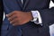 Keeping the time just got hi tech. Cropped view of a young businessman wearing a smartwatch - All screen content is