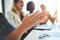 Keeping workers happy helps strengthen a company in many ways. Cropped shot of a group of businesspeople applauding a