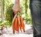 Keeping your eyesight perfect. A mature person holding a bunch of carrots.