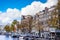The Keizersgracht Emperor`s Canal with its cafe terraces and large historic houses in the historic center of Amsterdam