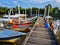 Kelantan, Malaysia -fishing boat near wooden jetty. Beautiful malaysian landscape. Sunset reflection in the water.