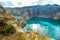 Kelimutu - Golden grass growing on the rim of a volcanic crater