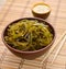 Kelp ( laminaria ) in a bowl on the white background.