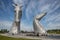 Kelpies sculpture by Andy Scott in Helix Park with people