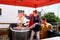 Kelsey Creek Farm Park heritage event, woman cooking kettle corn outside under a red a