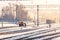 Kemerovo, Russia - march 2019 small railway station with workers on the tracks on a winter morning or evening