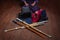 Kendo gloves, helmet and bamboo sword on a wooden surface