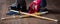 Kendo gloves, helmet and bamboo sword on a wooden surface