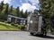 Kenmore, WA USA - circa May 2021: view of a UPS delivery truck driving up a hill in a residential neighborhood